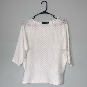White sweater. Thin, slightly shear material. Size: L